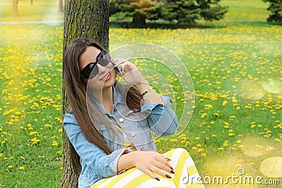 Beautiful smiling woman talking on mobile phone Stock Photo