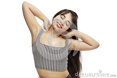 Beautiful smiling young girl stretches sweetly after sleep. Early awakening and healthy rest. Isolated on a white background Stock Photo