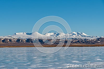 Beautiful snowcapped mountains seen from the highway in Iceland Stock Photo