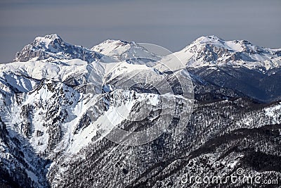 Beautiful snowy mountain peaks scenic winter landscape. Mounts Fisht, Pshekhasu, Oshten in Caucasus mountains Stock Photo