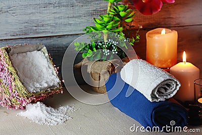 Beautiful spa composition with candles, flowers, jars of mineral salts, oils and other decoration elements Stock Photo