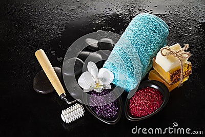 Beautiful Spa Set with Spa Products, Towel and Hot Stones. Horizontal with Copy Space. Stock Photo