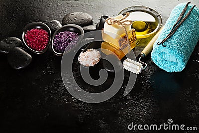 Beautiful Spa Set with Spa Products, Towel and Hot Stones. Horizontal with Copy Space. Stock Photo