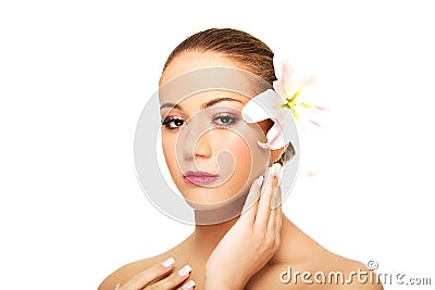 Beautiful spa woman with lily. Stock Photo