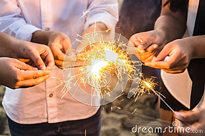 Beautiful sparklers in people hands, xmas and new year concept. Stock Photo