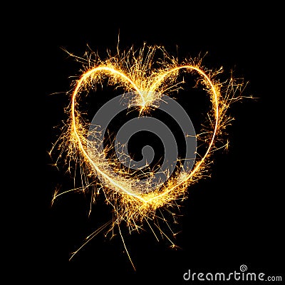 Sparkling golden heart isolated on black background Stock Photo