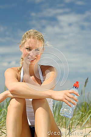 Beautiful sporty female on the beach Stock Photo