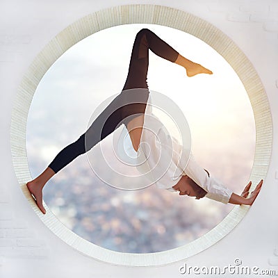 Beautiful sporty fit yogi woman practices yoga asana eka pada Adho Mukha Shvanasana - One Leg Downward Dog pose Stock Photo