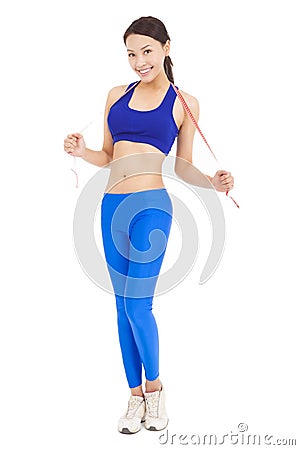 Beautiful sporty woman holding red tape Stock Photo