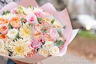 Beautiful spring bouquet in woman hand. Arrangement with various flowers. The concept of a flower shop. A set of photos Stock Photo