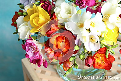 Beautiful spring bright freesia flowers on stand Stock Photo