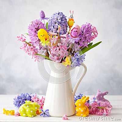 Beautiful spring flowers bouquet and Easter decor Stock Photo