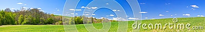 Spring rural landscape with field and blue sky, a panorama Stock Photo