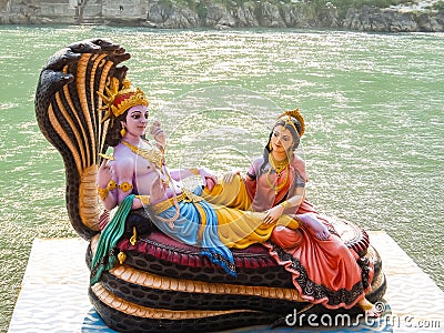 Beautiful statues of Lord Vishnu and Lakshmi at the Ganga riverbank in Rishikesh Editorial Stock Photo