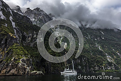 Beautiful steep cliff and boat on a surface Stock Photo