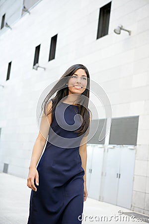 Beautiful stewardess walking to convention center Stock Photo