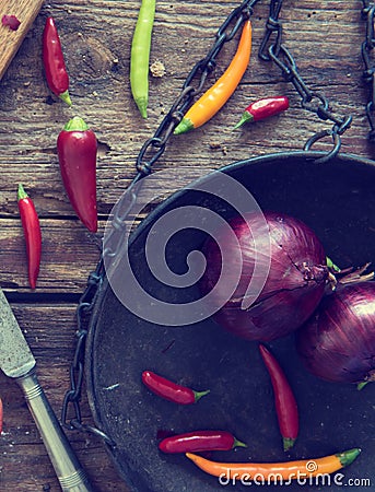 Beautiful still life with red onion and chili Stock Photo