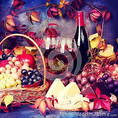 Beautiful still life with wine glasses, grapes, pomegranate and Stock Photo