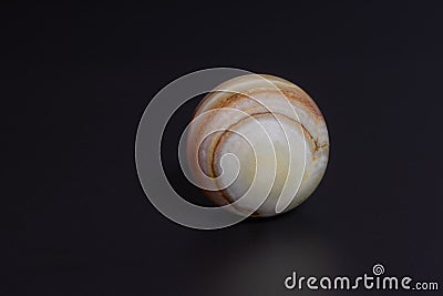 beautiful stone ball on a black background Stock Photo