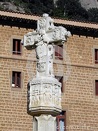 Beautiful stone cross with biblical figures on it Stock Photo