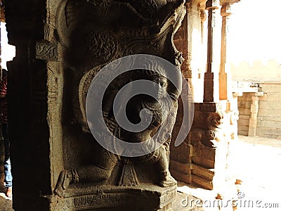 Beautiful stone pillars with god and goddess carving in Veerabhadra Hindu temple located at Lepakshi in the state of Andhra Stock Photo