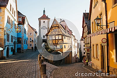 A beautiful street in Rothenburg ob der Tauber with beautiful houses in German style during the Christmas holidays Stock Photo