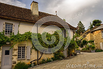 Beautiful street in Saint Ceneri Le Gerei in summer, France Editorial Stock Photo