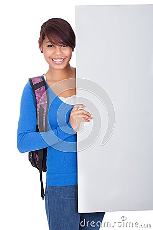 Beautiful student girl presenting empty banner Stock Photo