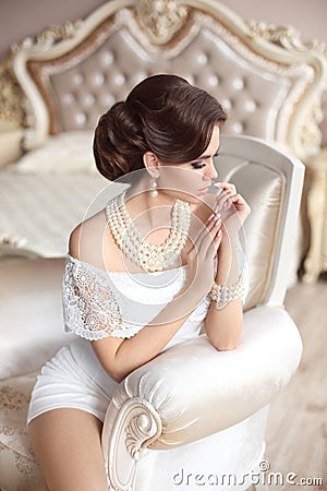 Beautiful stunning elegant lady with retro hairstyle, pearls Stock Photo