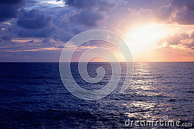 Beautiful stunning sunset at the sea, bright natural colors, background and texture Stock Photo