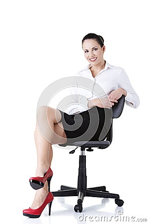 Businesswoman sitting on ofice chair Stock Photo