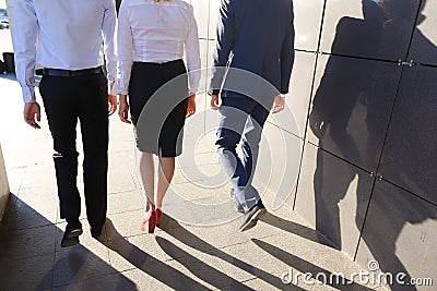 Beautiful successful people, two guys and girl, young businessme Stock Photo