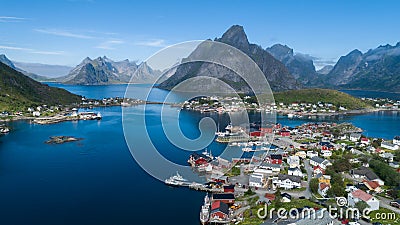 Beautiful summer aerial view of Reine, Norway, Lofoten Islands, with skyline, mountains, famous fishing village with red fishing c Stock Photo