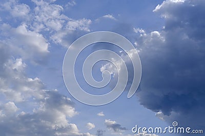 Beautiful summer landscap, echanges in weather, blue sky with white and dark clouds, concept of transcendence, Heaven and infinity Stock Photo