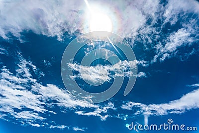 Beautiful sun shining over the cirrus cloud with magic flares. Stock Photo