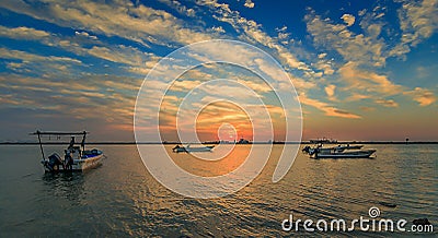 Beautiful Sunrise Boat in seaside with red and dark sky. Dammam -Saudi Arabia Editorial Stock Photo