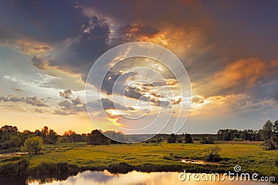 Beautiful sunrise and dramatic clouds on the sky. Stock Photo