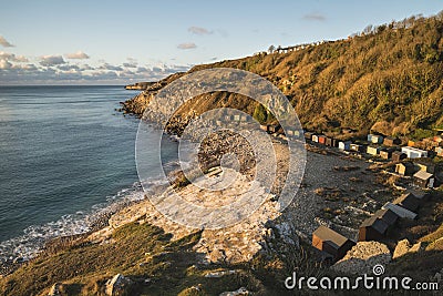 Beautiful sunrise landscape image of Church Ope Cove in Portland Stock Photo