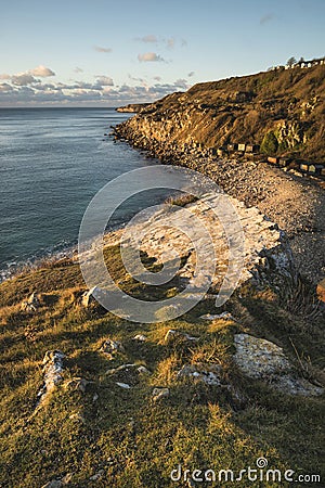 Beautiful sunrise landscape image of Church Ope Cove in Portland Stock Photo