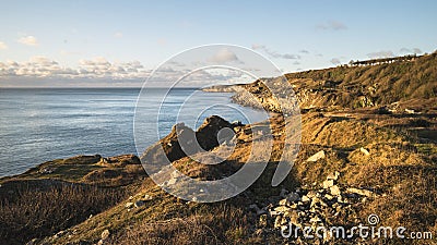 Beautiful sunrise landscape image of Church Ope Cove in Portland Stock Photo