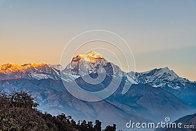 Beautiful sunrise light kissing Dhaulagiri mountain summit viewed from Poonhill Ghorepani Nepal Stock Photo