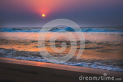 Beautiful sunrise over the beach in long exposure. Moving elements sunrise and wave photography from the beach in chennai, india. Stock Photo