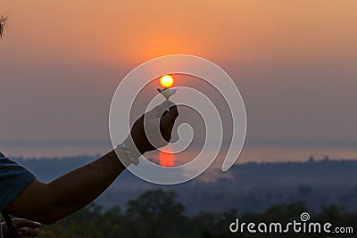 Beautiful sunrise,Silhouette peple with in sunrise, Thailand. Stock Photo