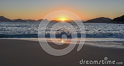 Beautiful Sunrise with the sun rising out of the ocean, Rio de Janeiro Stock Photo