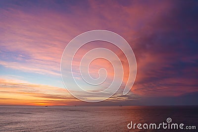 Beautiful sunrise, sunset sky over calm ocean Stock Photo