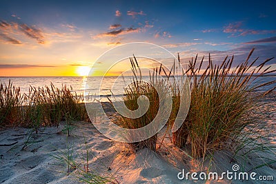 A beautiful sunset on the beach of the Sobieszewo Island at the Baltic Sea. Poland Stock Photo