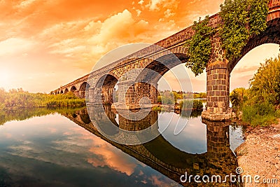 Overview at sunset of the Ancient Bridge of Orosei on the river Cedrino, Sardinia Stock Photo