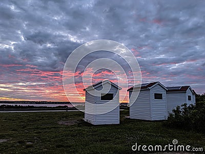 Sunset on Outhouses in Beavertail, Rhode Island Stock Photo