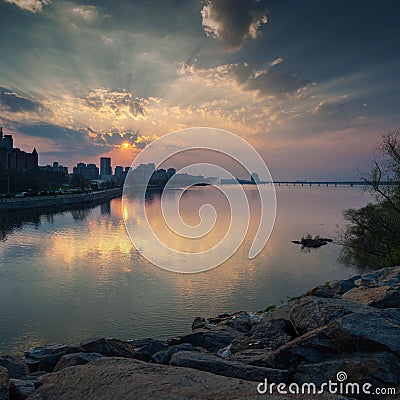 Beautiful sunset on the Dnieper River in the city of Dnipro Dnepropetrovsk, Ukraine. Stock Photo