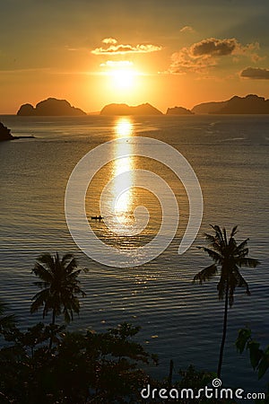 Beautiful sunset at Las Cabanas Beach at El Nido in Philippines Stock Photo
